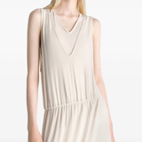 Tan dress worn by a person, showing the dress fit