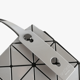 Close up of grey handbag,showing texture of the polyvinyl fabric.