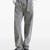 Grey pants worn by a person, showing the pants' fit
