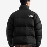 Black jacket worn by a person, showing the jacket fit