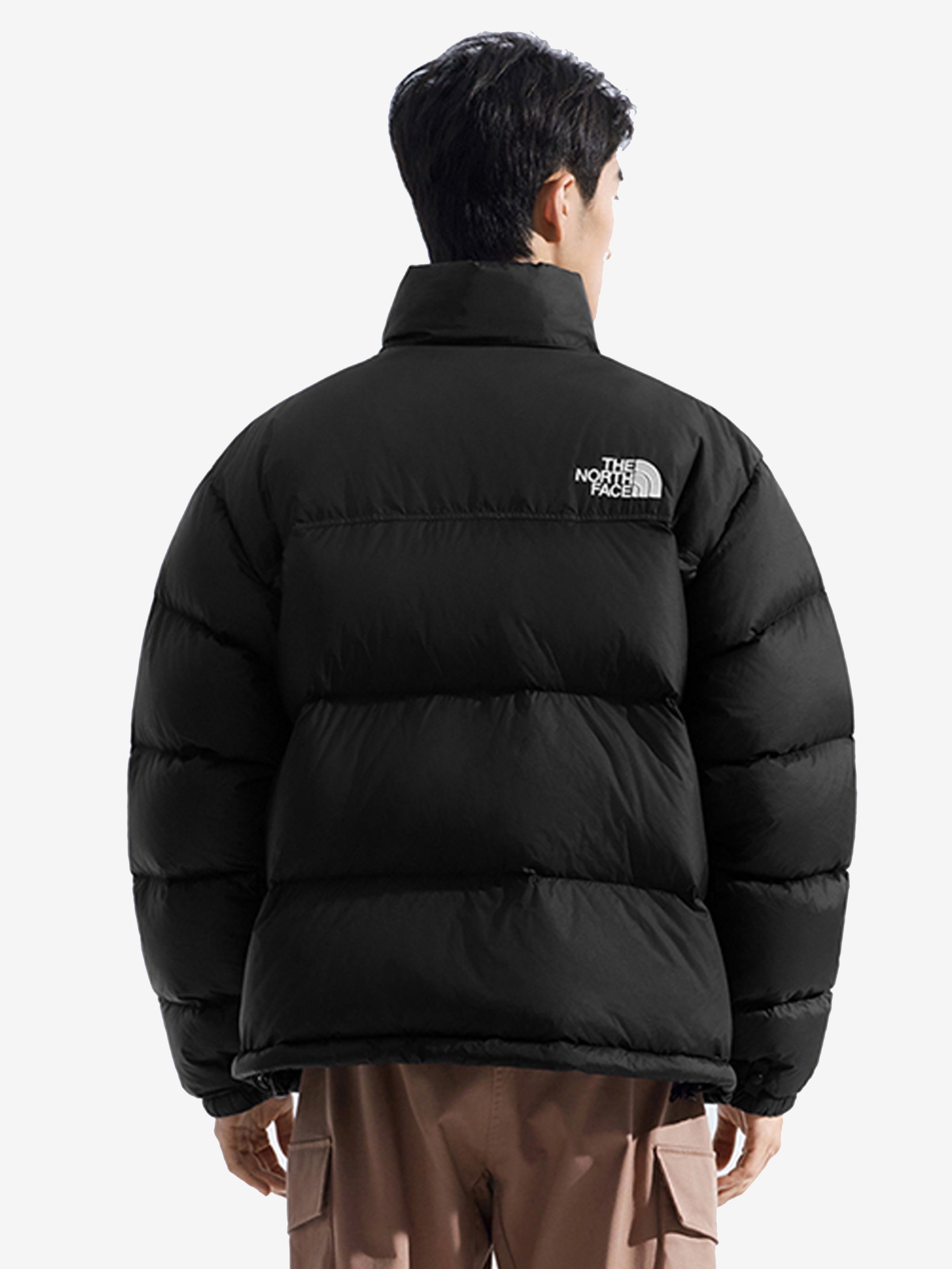 Black jacket worn by a person, showing the jacket fit