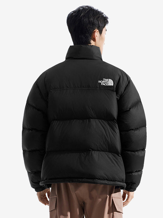 Black jacket worn by a person, showing the jacket fit