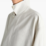 Close up of white coat, showing texture of the Cotton fabric