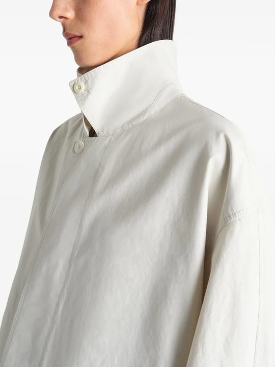 Close up of white coat, showing texture of the Cotton fabric