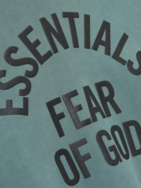 Cloes-up of green hooide, showing texture of the cotton fabric