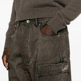 Grey jeans worn by a person, showing the jeans fit
