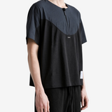 Black t-shirt worn by a person, showing the t-shirt fit