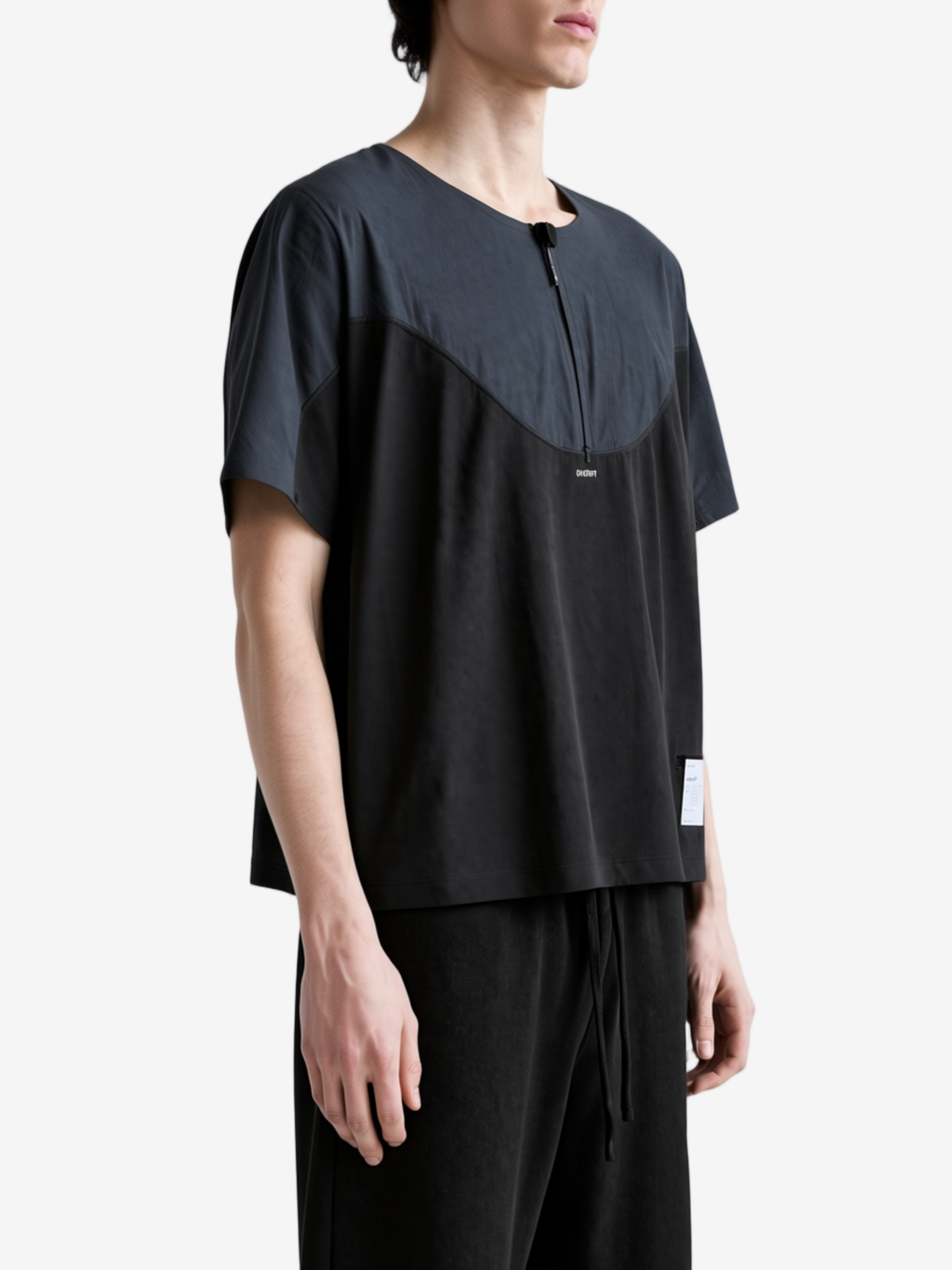 Black t-shirt worn by a person, showing the t-shirt fit