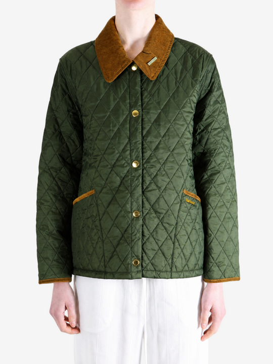 Green jacket worn by a person, showing the jacket fit