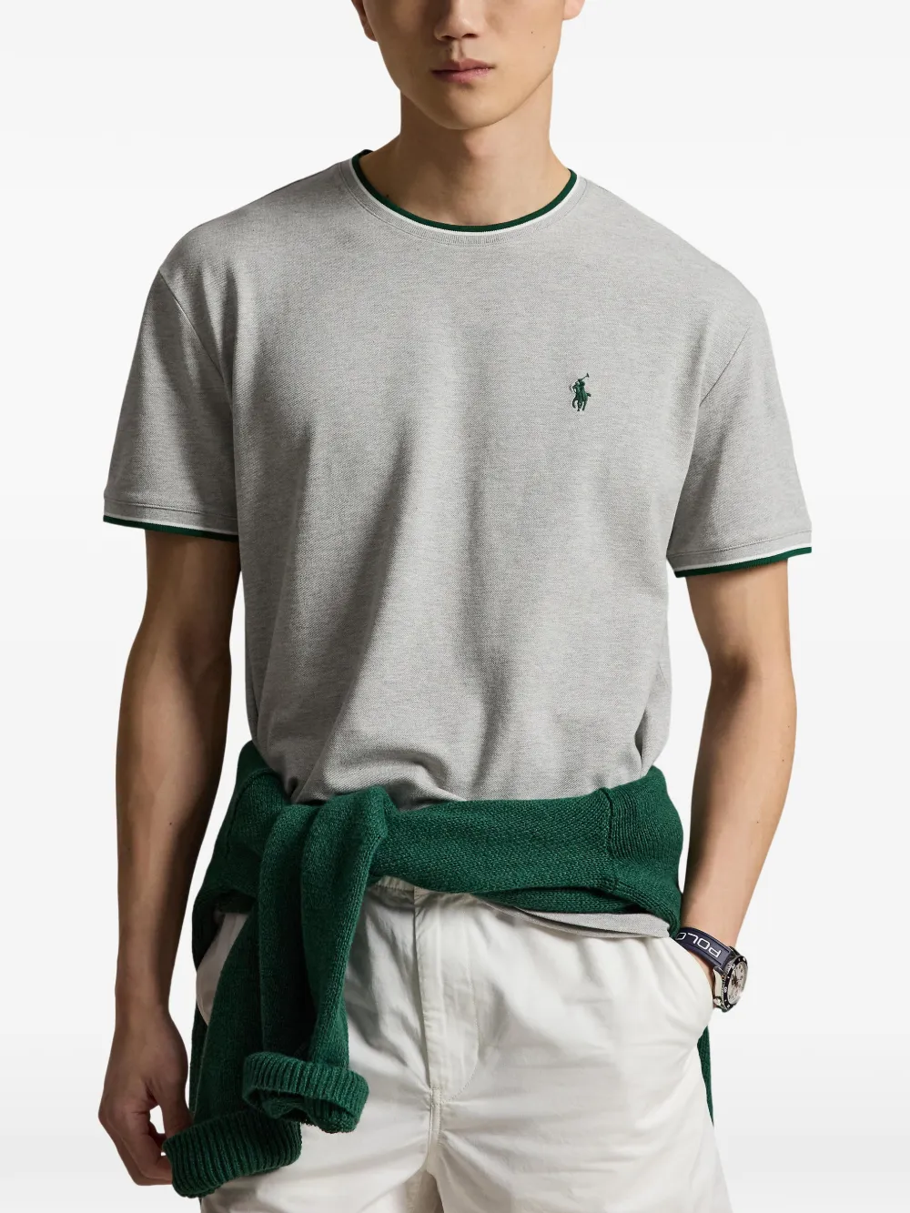 Grey t-shirt worn by a person, showing the t-shirt fit