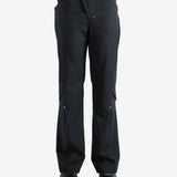 Black pants worn by a person, showing the pants' fit