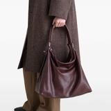 Brown bag worn by a person, showing the bag's fit