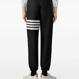 black pants worn by a person, showing the pants fit
