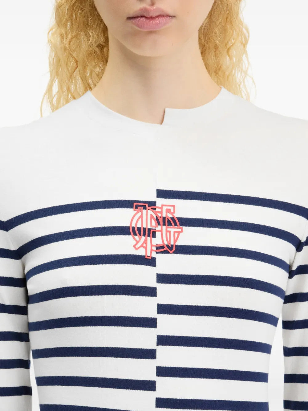 White top worn by a person, showing the top fit