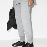 Black shoes worn by a person, showing the shoes fit