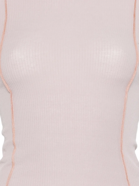 Close up of pink t-shirt, showing texture of the cotton fabric