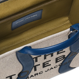 Close up of navy bag, showing texture of the  fabric