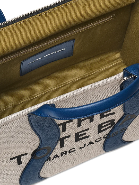 Close up of navy bag, showing texture of the  fabric