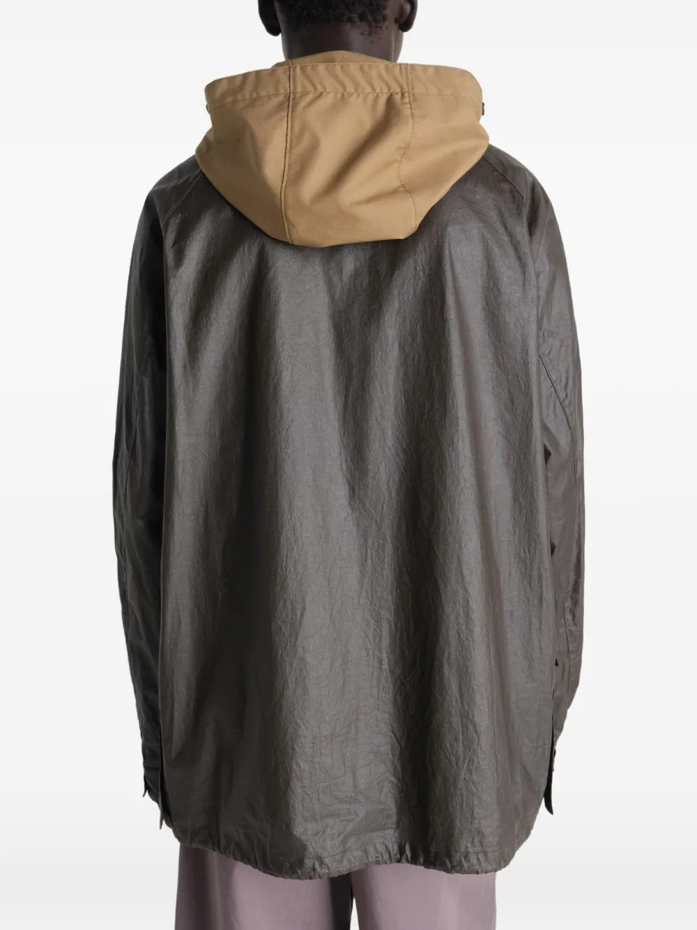 Brown jacket worn by a person, showing the jacket's  fit