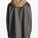 Brown jacket worn by a person, showing the jacket's  fit