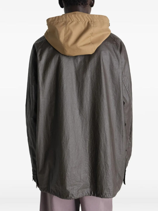 Brown jacket worn by a person, showing the jacket's  fit