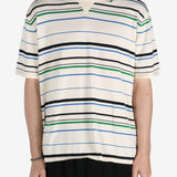 Tan shirt worn by a person, showing the shirt's fit