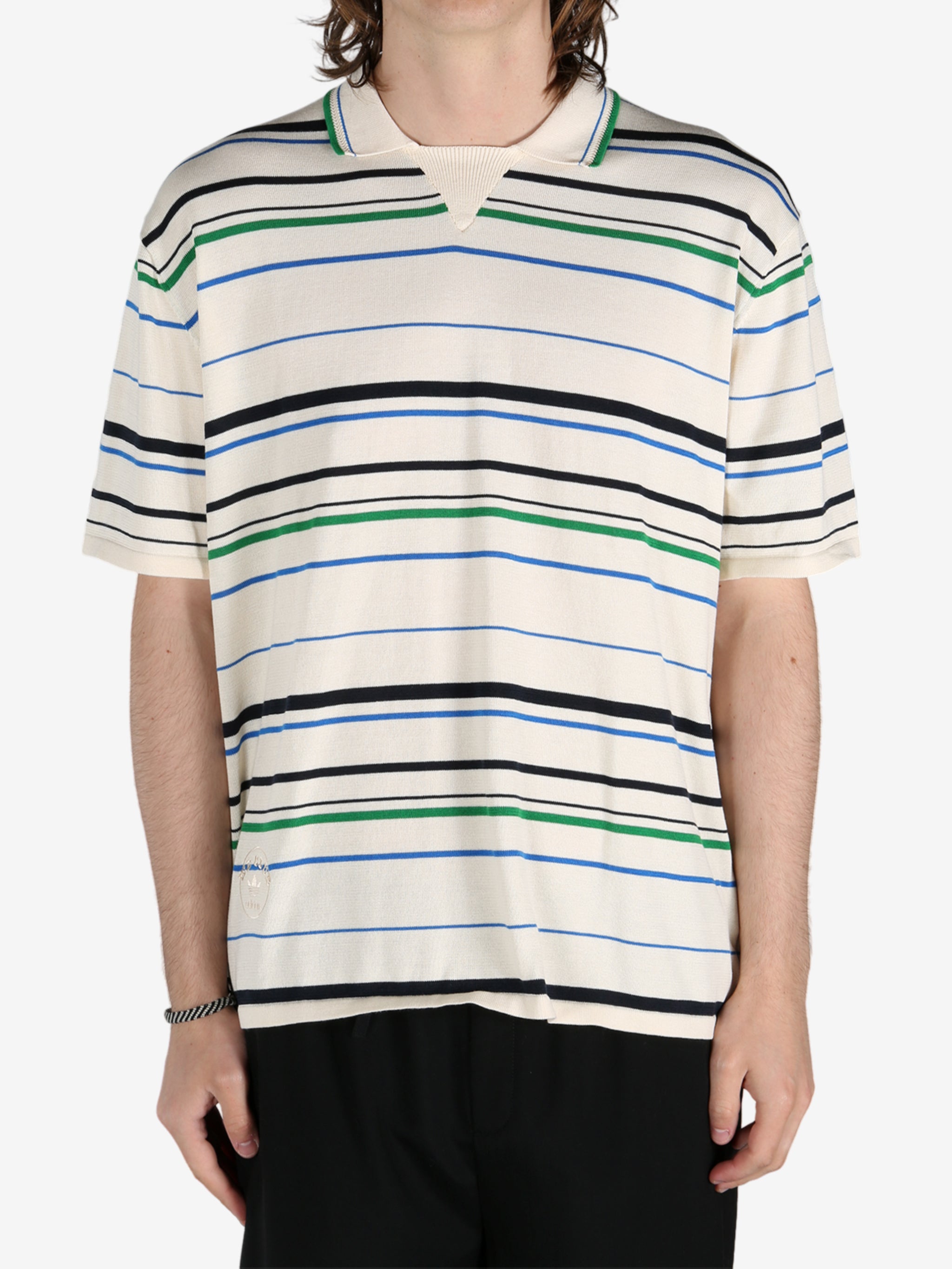 Tan shirt worn by a person, showing the shirt's fit