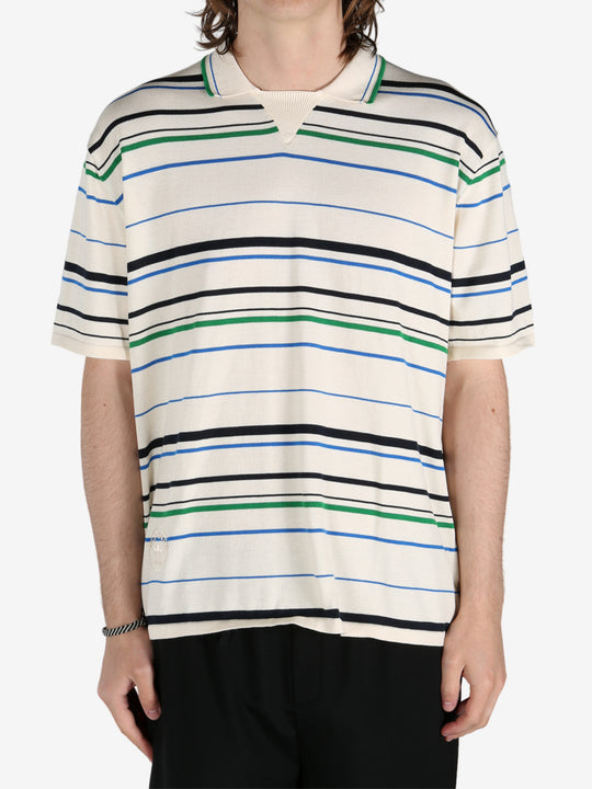 Tan shirt worn by a person, showing the shirt's fit