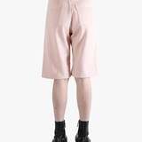Pink shorts worn by a person, showing the shorts's fit
