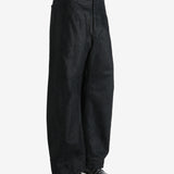 Black pants worn by a person, showing the pants fit