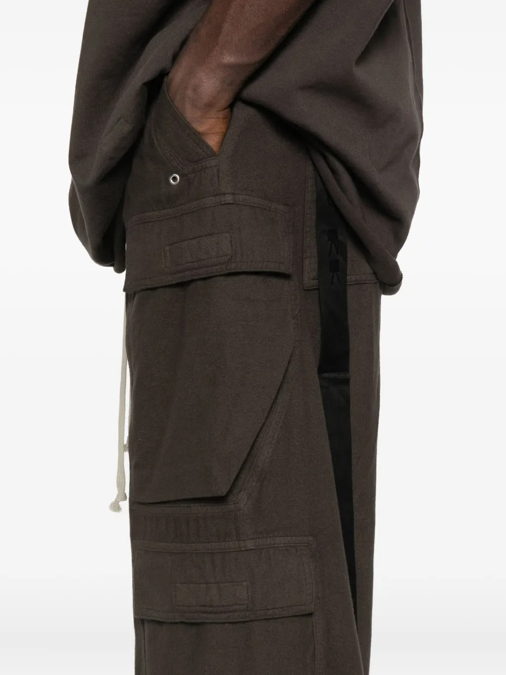 Close up of the brown pants, showing texture of the wool fabric