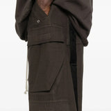 Close up of the brown pants, showing texture of the wool fabric