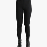 Black pants worn by a person, showing the pants fit