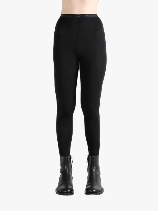 Black pants worn by a person, showing the pants fit