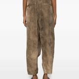 Brown pants worn by a person, showing the pants's fit