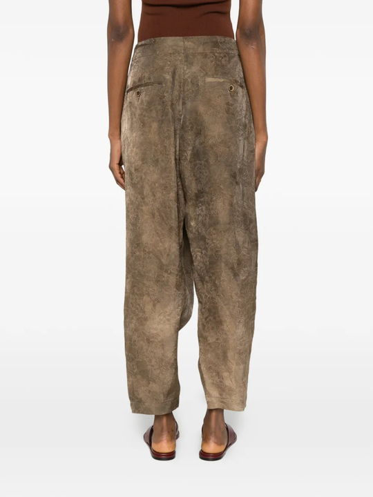Brown pants worn by a person, showing the pants's fit