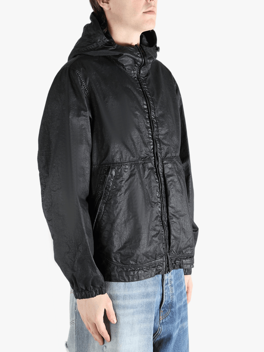 Black jacket worn by a person, showing the jacket fit