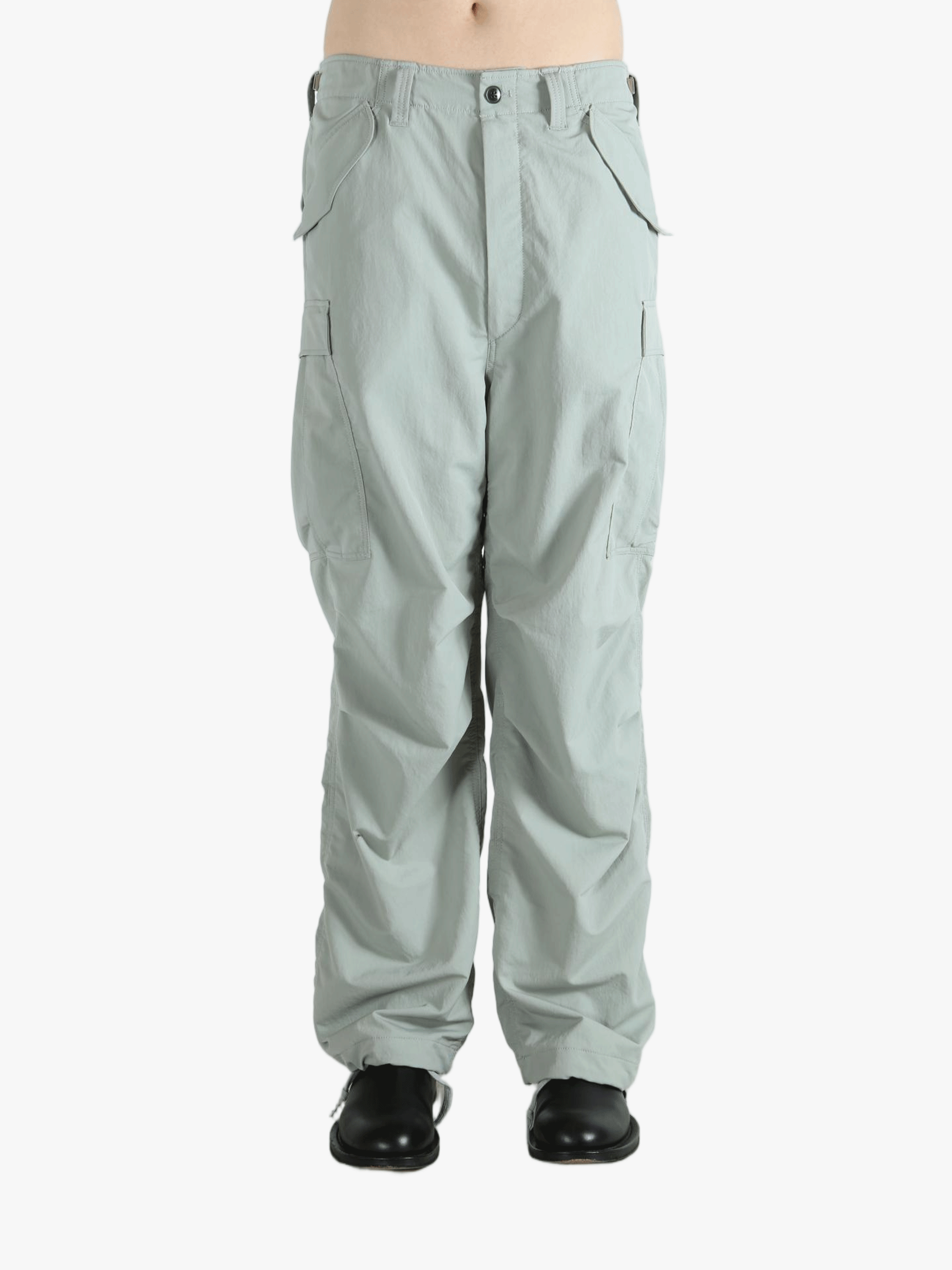 Grey pant worn by a person, showing the pant's fit