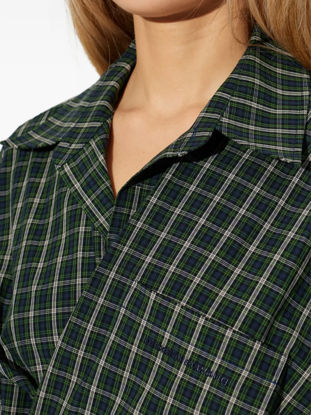 Green dress worn by a person, showing the dress fit