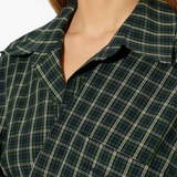 Green dress worn by a person, showing the dress fit