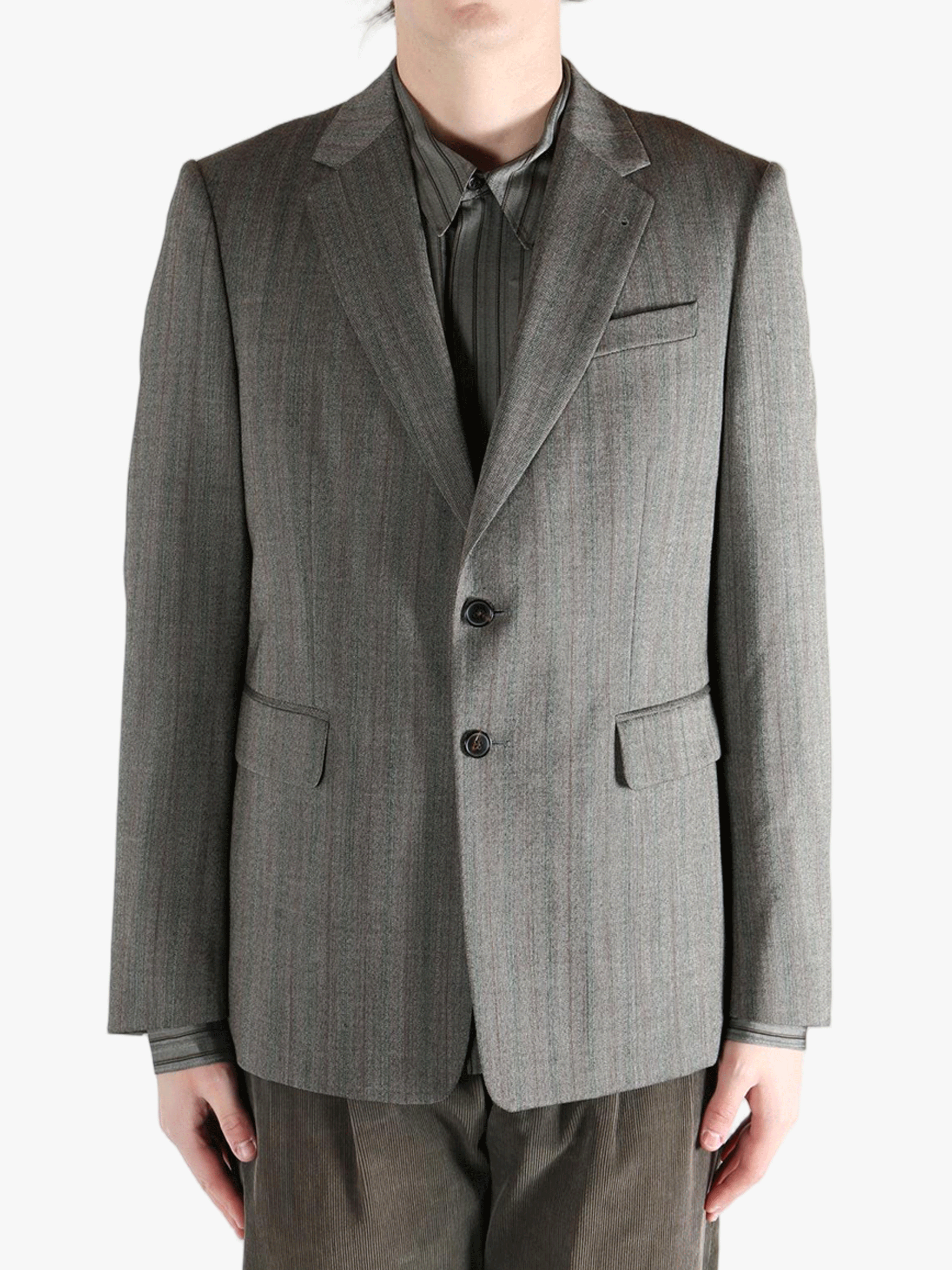 Grey jacket worn by a person, showing the jacket's fit
