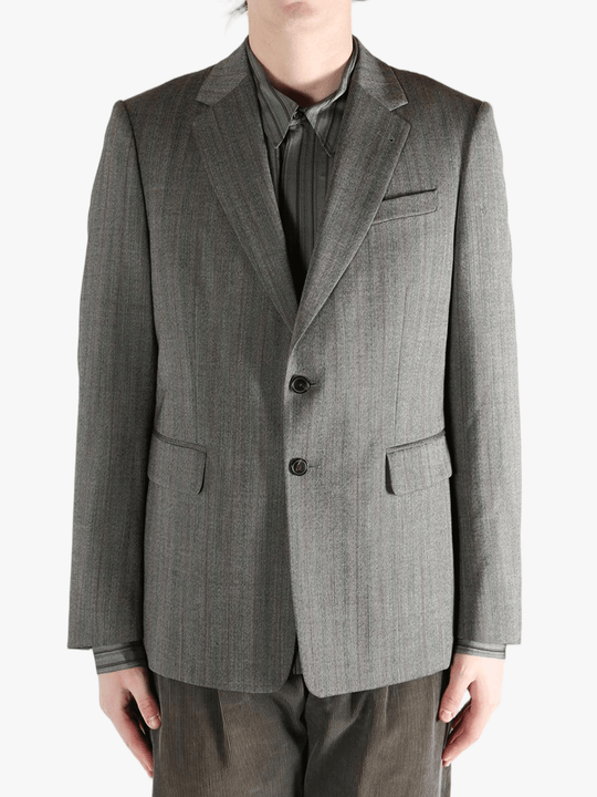 Grey jacket worn by a person, showing the jacket's fit