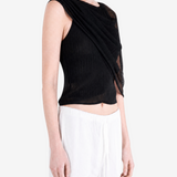 Black top worn by a person, showing the top fit