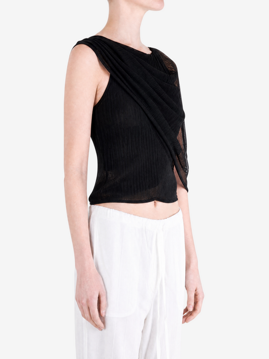 Black top worn by a person, showing the top fit