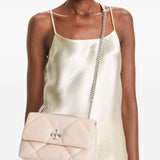 Pink bags worn by a person, showing the bags fit