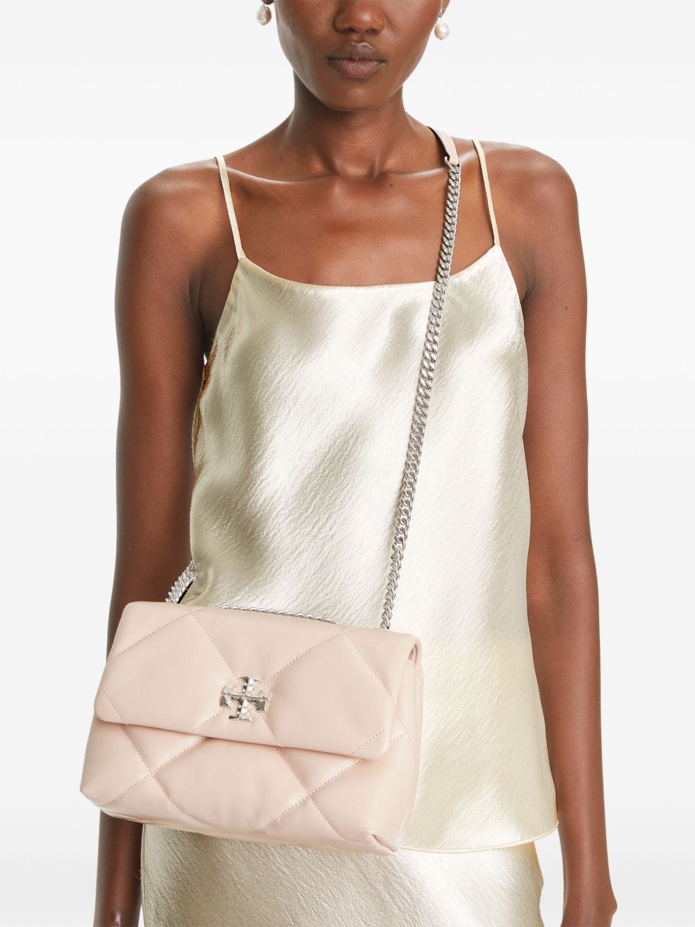 Pink bags worn by a person, showing the bags fit