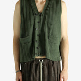 Green vest worn by a person, showing the vest fit