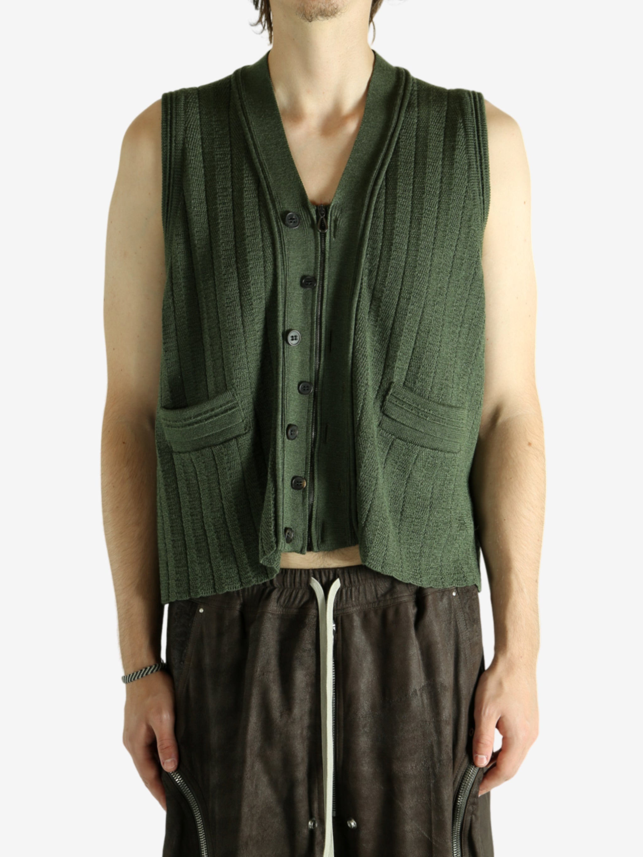 Green vest worn by a person, showing the vest fit