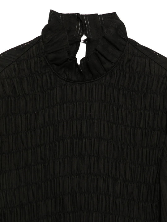 Close up of Black top, showing texture of the 100% cotton fabric