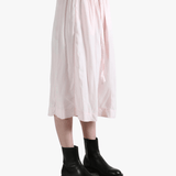 Pink pants worn by a person, showing the pants fit